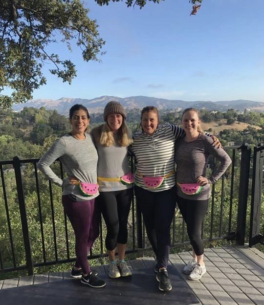 Friends on a girls’ weekend on the view deck at Marin Vista Retreat, with Lucas Valley mountains behind